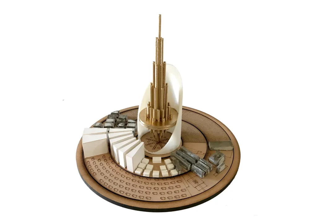 Physical model of the whole city: the gold tower on a round laser-cut base, surrounded by blocks of buildings
