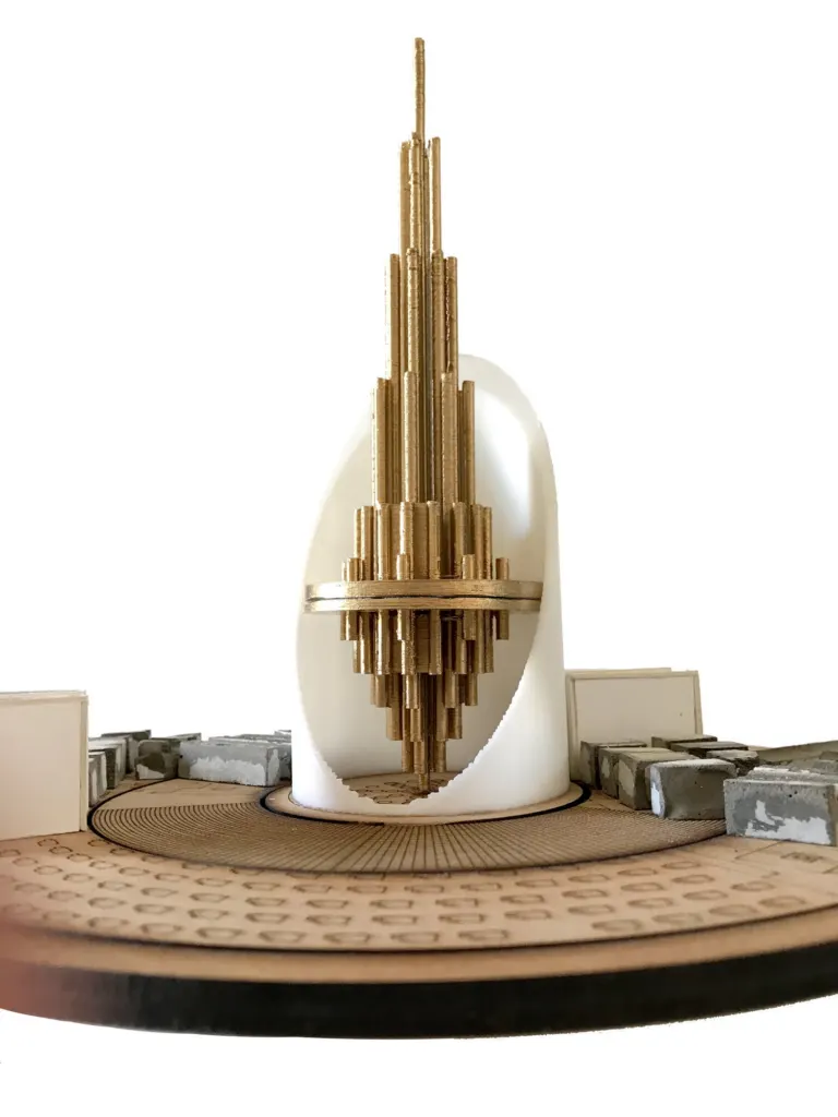 Physical model of the 42 tower: a stepped gold tower inside a white curved shell on a round base